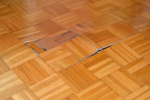 Sand water damage on wood floor